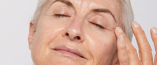 woman applying eye serum