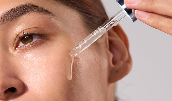  model dispensing serum onto face 