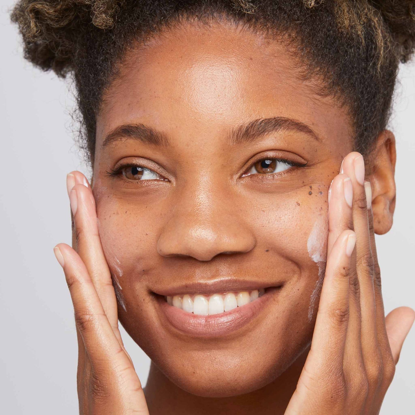 woman applying skin smoothing cream 